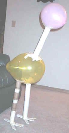 a balloon sitting on top of a metal pole in the middle of a living room