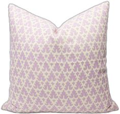 a purple and white pillow with an intricate pattern