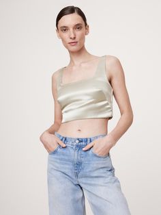 We cut this elegantly understated top from a high-shine satin, keeping the silhouette free from ornament so it’s the perfect blank canvas.  Fitted: Slim.  Sits close to the body.  Square neck.  Invisible zip at back.  Hidden elastic panels at back for a custom fit.  Fully lined.  Fitted: Slim.  Sits close to the body.  Sleeveless.  Cropped length.  Model: Size S, 5'10" (178cm). Elegant Cropped Silk Tops, Silk Cropped Evening Top, Silk Cropped Top For Evening Wear, Silk Cropped Top For Evening, Satin Cropped Top For Evening, Elegant Silk Cropped Crop Top, Silk Cropped Top For Night Out, Evening Satin Cropped Top, Cropped Satin Top For Evening