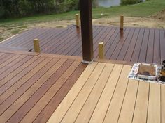 there is a cake on the wooden deck