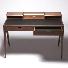 a wooden desk with two drawers on it