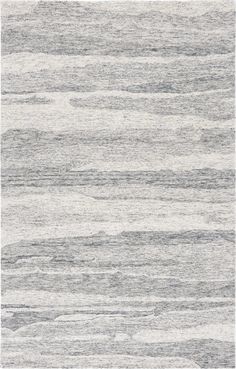 an area rug with grey and white stripes