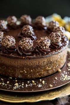 a chocolate cake topped with lots of nuts