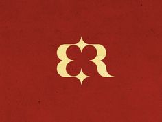 a red book with white letters and a gold letter on the cover that says,