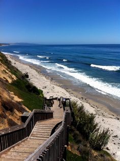 stairs lead down to the beach and ocean