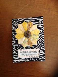 a close up of a piece of cloth on a table with a zebra print background