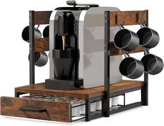 a coffee machine with pots and pans hanging from it's rack on a white background