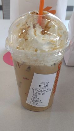 a close up of a cup of food on a table with a price tag attached to it