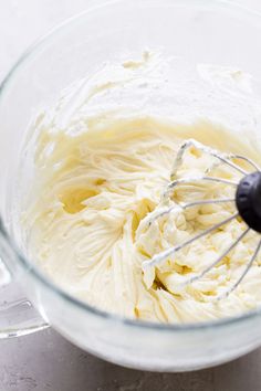 a mixing bowl filled with white batter