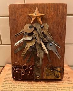 a bunch of keys are in a wooden frame with a star on the top and bottom