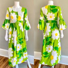 Adorable 1970s Malia Honolulu maxi dress. It is made of a substantial ribbed cotton in green with huge daisies print. It has an empire waist with matching fabric tie belt, fabric covered buttons down the front, 3/4 length puffed sleeves.  Great & clean condition, there are some scattered spots throughout - they are faint and small - some on the back of one of the puff sleeves, one on the fabric belt SIZE : tag size 8, fits like an Xs  Measurements - Bust : 32 Waist : 26 (empire) Hips : 36 Length Retro Green Long Sleeve Maxi Dress, Green Long Sleeve Retro Maxi Dress, Retro Green Floral Print Maxi Dress, Retro Cotton Maxi Dress, Green Retro Maxi Dress With Floral Print, 1970s Green Floral Print Dress, Vintage Green Spring Maxi Dress, 1970s Style Green Floral Print Dress, Vintage Green Maxi Dress For Spring