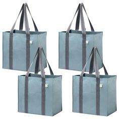 four bags with handles and straps are shown in three different colors, one is light blue