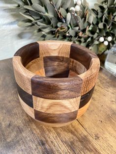 a wooden bowl sitting on top of a table