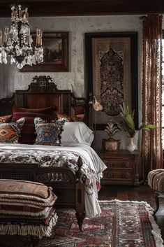 a bedroom with an ornate bed and chandelier hanging from the ceiling, surrounded by antique furniture