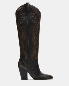 A Western boot is a requirement for any wardrobe and we’re obsessed with LASSO. This knee-high pair features whipstitching detail and a towering block heel. 3.75 inch heel height Size 6 measurements: 17 inch shaft circumference, 13.5 inch shaft height Size 8 measurements: 18 inch shaft circumference, 14.25 inch shaft height Size 10 measurements: 19 inch shaft circumference, 15 inch shaft height Leather upper material Textile and synthetic lining Synthetic sock Synthetic sole Imported Western Knee-high Boots With Stacked Heel, Western Wide Calf High Heeled Boots, Western Style Heeled Boots With Wide Calf, Western Style Wide Calf Heeled Boots, Western Style High Heel Boots For Wide Calves, Fall Wide Calf Knee-high Boots For Rodeo, Winter Knee-high Boots For Rodeo, Western Knee-high Boots With Reinforced Heel For Fall, Tall Fall Boots With Reinforced Heel