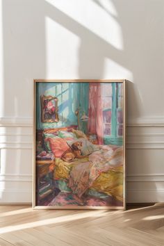 a painting hanging on the wall above a bed in a room with white walls and wooden floors