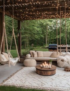 an outdoor living area with furniture and lights