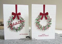 two christmas cards with holly wreaths on them