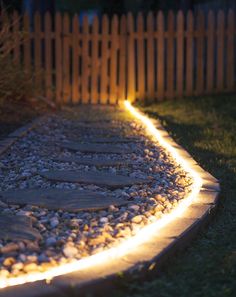 an image of a pathway that is lit up with the text amazing backyard lighting landscape pointers