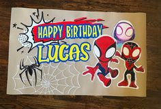 a birthday card with spiderman and other stickers on it's side, which says happy birthday lucas