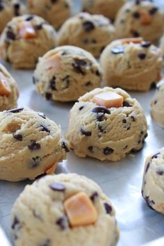 chocolate chip cookies on a baking sheet ready to be baked in the oven or eaten