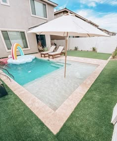 a pool with an inflatable slide next to it and a house behind it