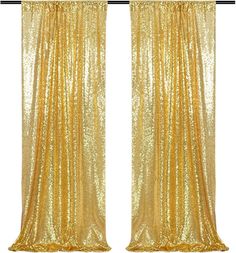 two gold curtains with sequins on them