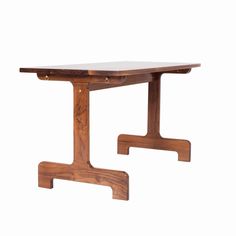 a wooden table with two legs and a white surface on the top, against a white background