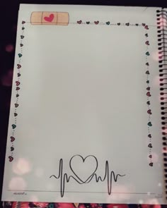 a notepad with a heart and heartbeat on it