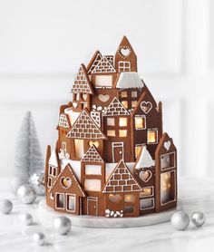 a gingerbread house is lit up for christmas