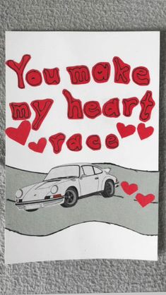 a piece of paper that says, you make my heart race with a car on the road