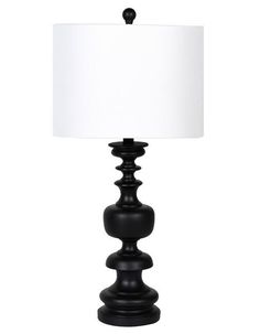 a black table lamp with a white shade on the top and bottom part of it