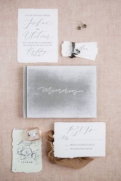 the wedding stationery is laid out and ready to be used as an envelope for guests