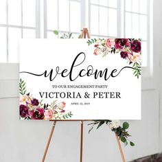 a sign that says welcome to the bridal shower with flowers and greenery on it