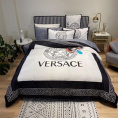 the versa bedding set is on display in front of a white wall and wooden floor