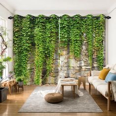 a living room with a couch, chair and wall covered in green ivys on the walls