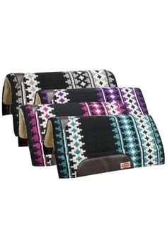 four pieces of saddle cloth in various colors and patterns, all with zippered closures