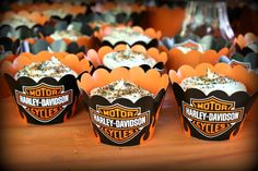 cupcakes are lined up on a table for harley - davidson's birthday