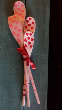 three wooden spoons with hearts on them