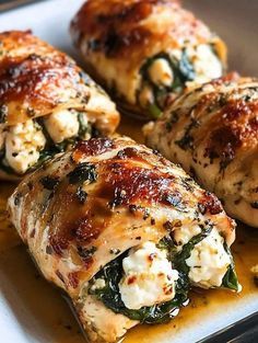 chicken wrapped in spinach and cheese on a plate