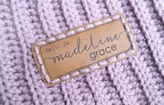 there is a label that says madeline grace on the back of a purple sweater