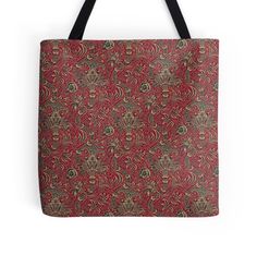 a red tote bag with an ornate pattern