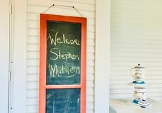 a welcome sign on the front door of a house