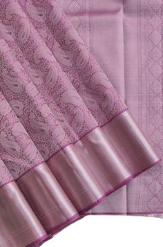 pink colored soft silk saree with intricate design on the border and palluri work