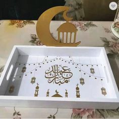 the tray is decorated with arabic calligraphy