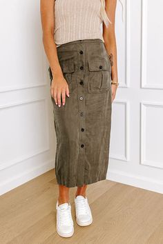 - Stroll down the street in style with this trendy skirt! - Waistline with elastic back - Button down - Two functional front pockets with button closure - Straight cut with finished hemline - Fitted silhouette Measurements S : Hip 32", Length 33", Waist 24-26". M : Hip 34", Length 34", Waist 26-28". L : Hip 36", Length 34.5", Waist 28-30". Utility Button-up Bottoms For Fall, Button-up Utility Bottoms For Fall, Fall Utility Button-up Bottoms, Casual Green Cargo Skirt For Fall, Khaki Cotton Cargo Skirt For Fall, Trendy Khaki Cargo Skirt With Pockets, Casual Cotton Cargo Skirt With Button Closure, Fall Khaki Cotton Cargo Skirt, Fall Skirt With Pockets For Day Out