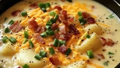 potato soup with bacon and cheese in a black bowl