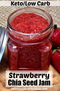 strawberry chia seed jam in a glass jar with strawberries on the side and text overlay that reads keto / low carb