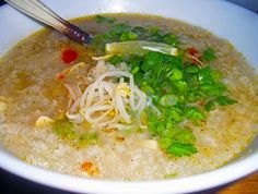 a white bowl filled with soup and veggies