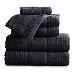 black towels stacked on top of each other